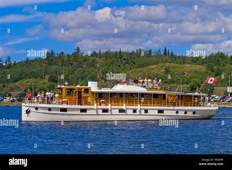 canada ontario kenora people on vintage wooden boat credit as mike grandmaison jaynes