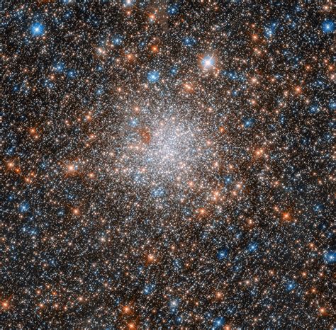 Hubble Spies Glittering Star Cluster In Nearby Galaxy Follow