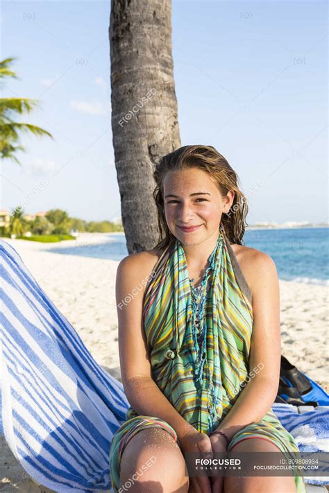 Smiling Teenage Girl Sitting In Beach Chair Grand Cayman Relaxation