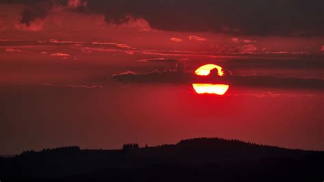 Download Wallpaper 1366x768 Sunset Sun Clouds Dusk Dark Landscape