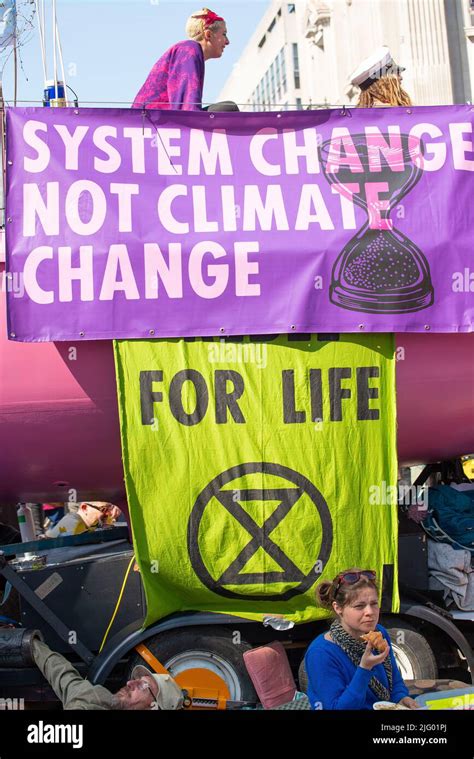 Climate Change Protesters With Signs At The Extinction Rebellion