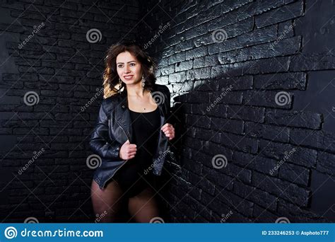 Studio Portrait Of Brunette Girl In Black Leather Jacket Stock Image