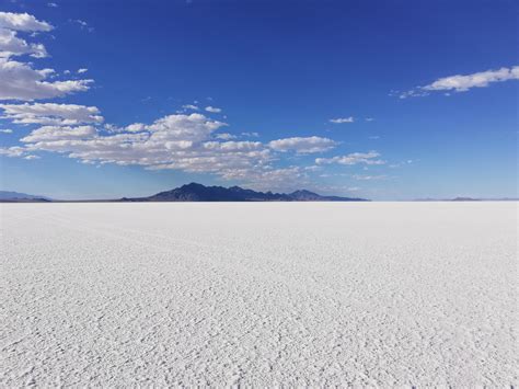 Long shadows fall on the salt flats near west wendover nevada on the border with utah. Bonneville Salt Flats, Utah (4608x3456) OC : EarthPorn