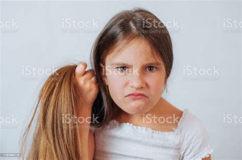 Caucasian Little Cute Girl Unhappy With Very Long Hair Portrait Stock