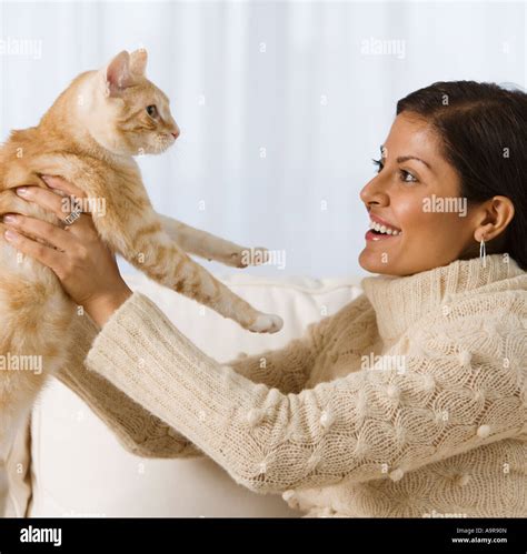 Indian Woman Holding Cat Stock Photo Alamy