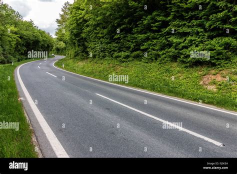 Straight Asphalt Road Leading Into The Distance Stock Photo Alamy