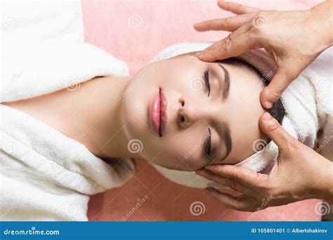 Woman Lying With Closed Eyes And Having Face Or Head Massage In Spa Stock Image Image Of