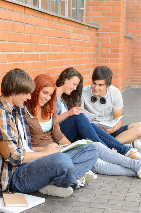 Students Friends Sitting On Ground Outside Campus Stock Photo Image
