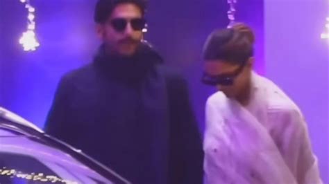 ranveer singh and deepika padukone walk out of the airport holding hands fan says ‘just looking