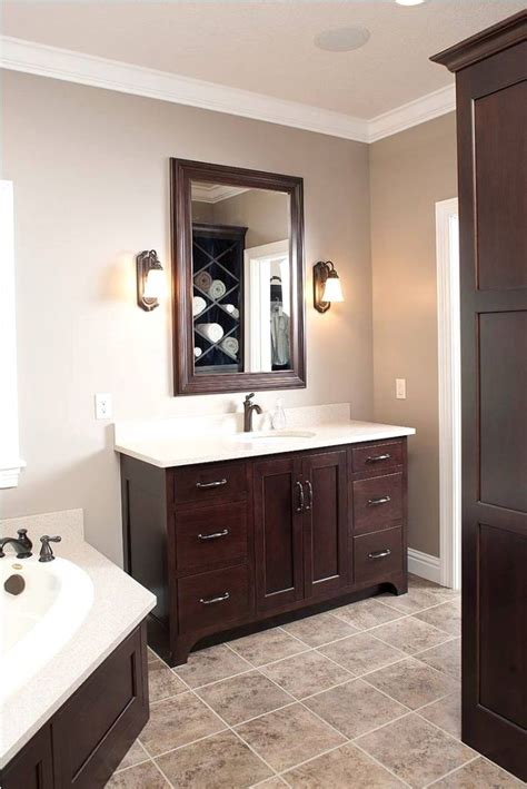 When the wall color competes or clashes with the colors in wood cabinets, trim or furn. Bathroom Color Ideas With Brown Cabinets | Wood bathroom