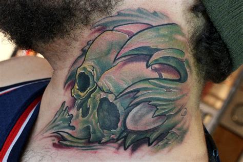 Biomechanical Skull Neck Tattoo For Men
