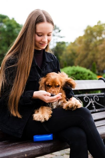 Free Photo Portrait Of Young Woman Holding Her Dog