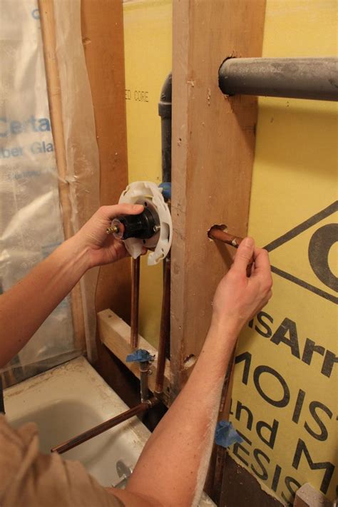 Install the replacement mixing valve by turning into the faucet in a clockwise direction. How to Raise and Install Tub-Shower Fixtures