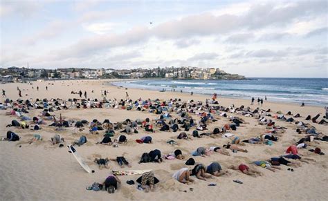G Climate Protesters Bury Heads In Bondi Sands In Australia