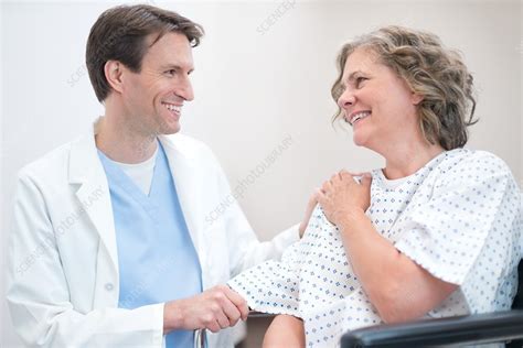 doctor smiling at woman patient stock image f018 2544 science photo library