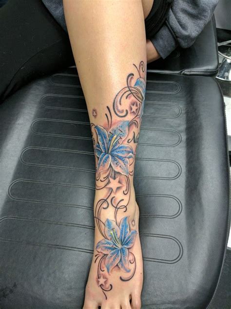 Here's another way to go from foot to ankle to leg tattoo in one shot. lily tattoo, lilies, foot ankle tattoo, stars, leg calf ...