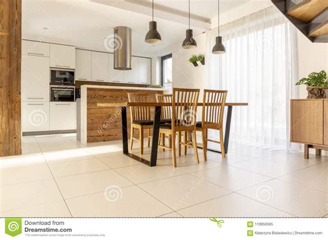 Kitchen floor tiles large white. Spacious, Open Kitchen And Dining Room With Wooden Table ...