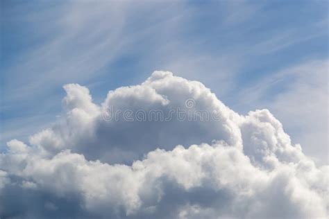 A Big And Fluffy Cumulonimbus Cloud In The Blue Sky Background Stock