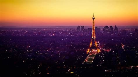 Download The Eiffel Tower At Paris Sunset Wallpaper