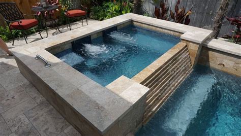 Travertine Raised Spa With Stacked Stone Spillover Custom Pools