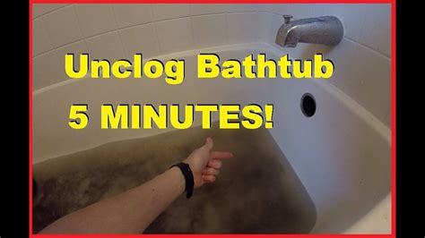 Unscrew the overflow plate from the end of the tub. How To Easily Unclog Bathtub Shower Drain in 5 minutes ...