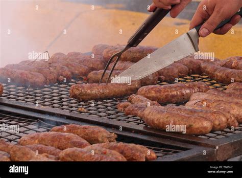 Typical Argentine Chorizo Grilled In The Street It Is Consumed As The