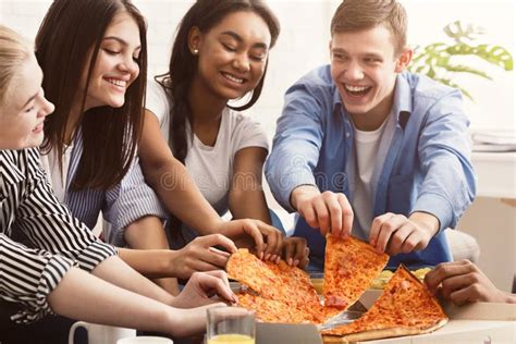 Friends Eating Pizza Spending Time Together At Home Stock Image Image Of Multiracial