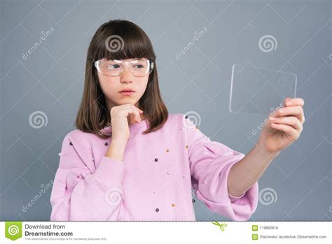 Pleasant Teenage Girl In Smart Glasses Using Transparent Device Stock