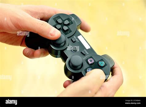 Hand Holding Playstation Controller Hi Res Stock Photography And Images