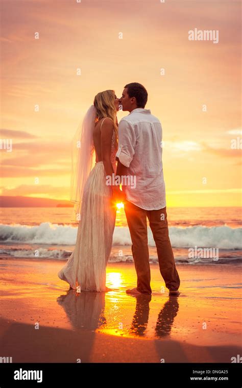 Just Married Couple Kissing On Tropical Beach At Sunset Hawaii Beach Wedding Intimate Loving