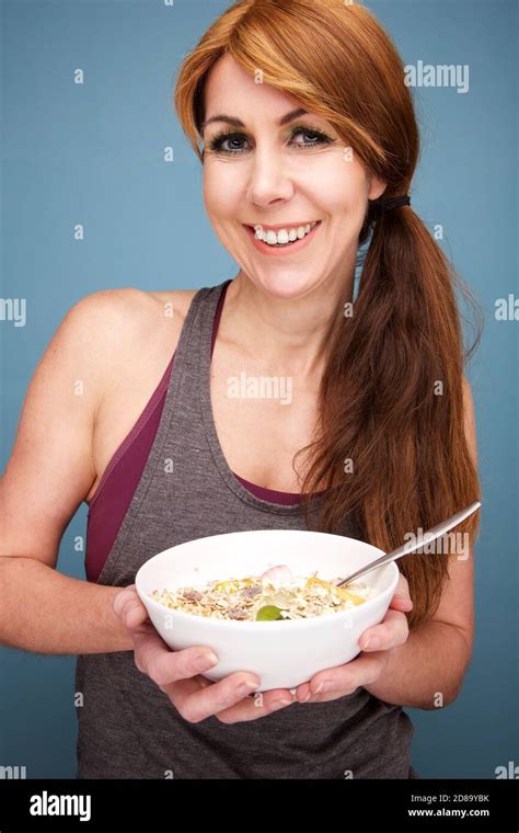 Close Up Portrait Of Beautiful And Fit Mature Woman With A Bowl Of