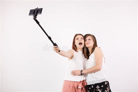 Two Female Best Friends Having A Lot Of Fun While Taking A Selfie With