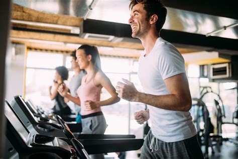 Happy Fit People Running On Treadmill At Fitness Gym Club Body Edge