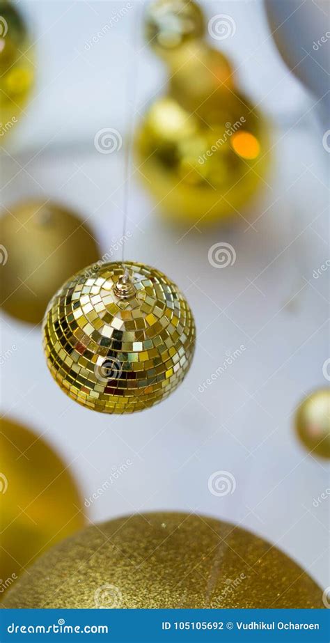 Hanging Shiny Golden Ball And Lighting Christmas Wreath Stock Photo