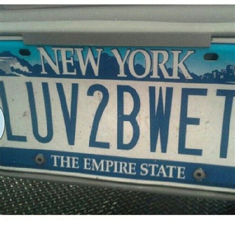 New York License Plate With The Empire State In Blue And White On An