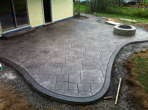 Matcrete ashlar patterns are made up of random sized pieces of slate and stone and are suitable for both commercial and residential applications. Stamped concrete patio and fire pit. Large ashlar pattern ...