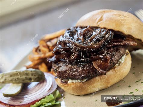 Hamburger With Caramelized Onions Front View Fast Food Stock Photo