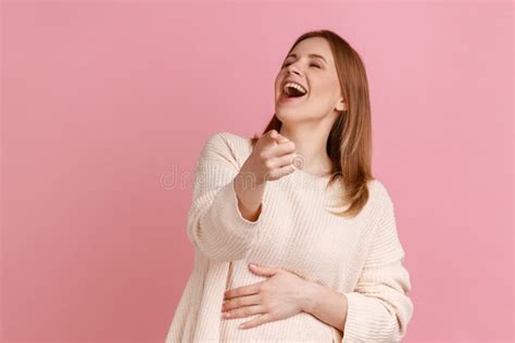 Woman Laughing Out Loud Pointing Finger Making Fun Of You And Looking At Camera Joke Stock