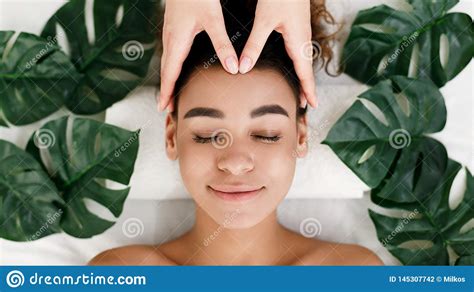 Face Massage African American Girl Getting Spa Treatment Stock Photo
