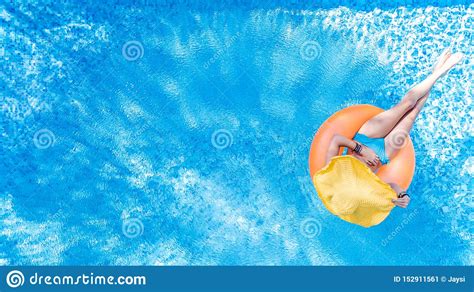 Beautiful Young Woman In Hat In Swimming Pool Aerial Top View From