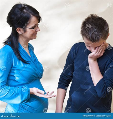 Mother Scolding Her Son With Two Smarthphones Royalty Free Stock Image