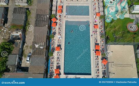 Drone Aerial View People Swim In Pool On Territory Modern Residential