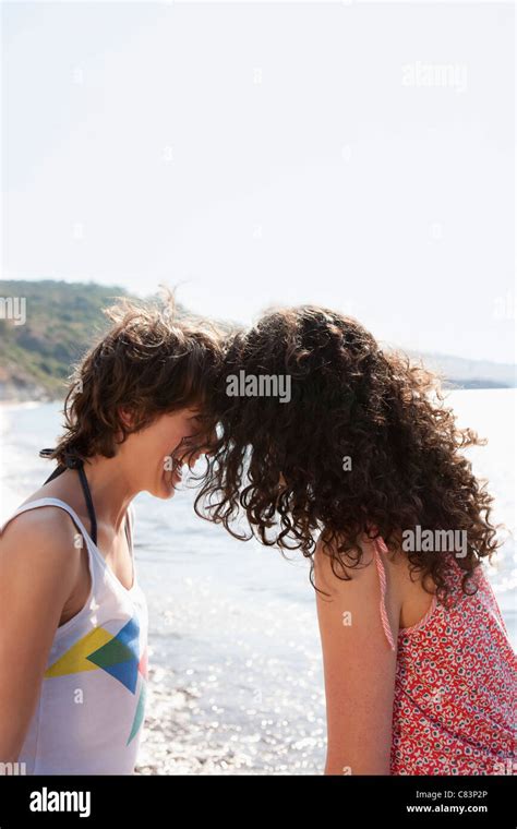 Women Laughing Together Outdoors Stock Photo Alamy