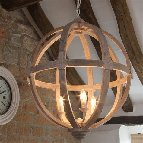 Designer details abound in this round lantern pendant light. large round wooden orb chandelier by cowshed interiors ...