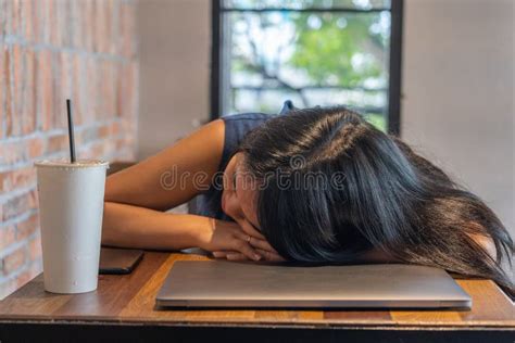Close Up Of Asian Woman Freelancer Falling Asleep On Laptop Stock Image