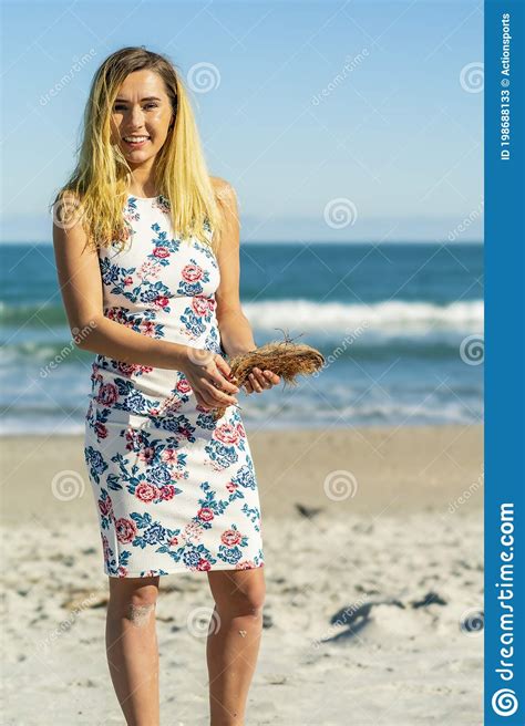 Beautiful Bikini Model Walks On The Beach Near The Shoreline Stock