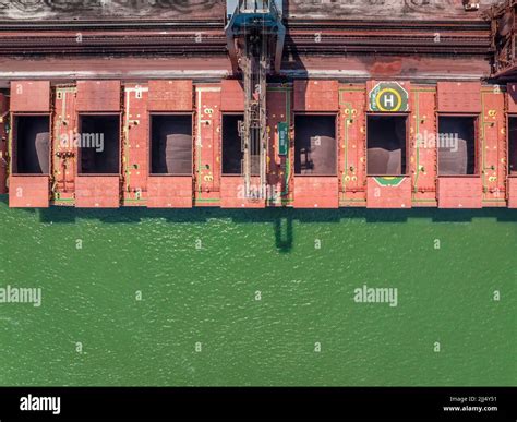 Bulk Carrier Ship Unloading Cargo By Crane At Port Stock Photo Alamy