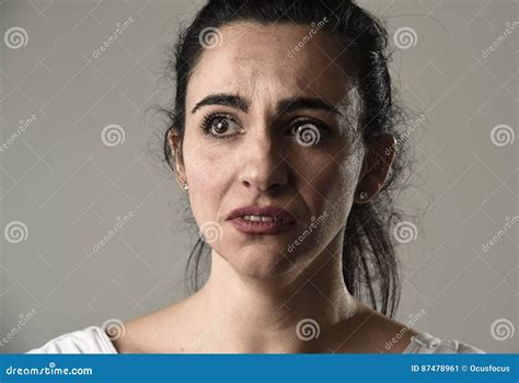 Beautiful And Sad Woman Crying Desperate And Depressed With Tears On