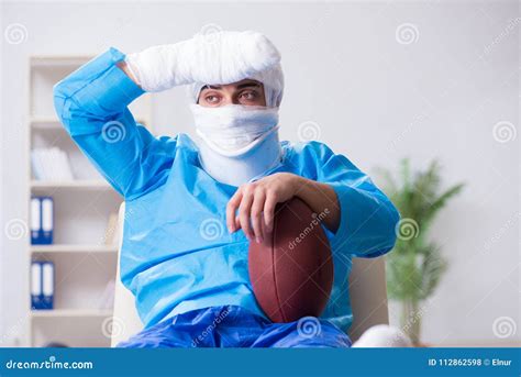 The Injured American Football Player Recovering In Hospital Stock Photo