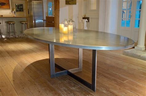 Large oval dining table with marble top. Contemporary Oval Shaped Zinc-Top Dining Table on Steel ...